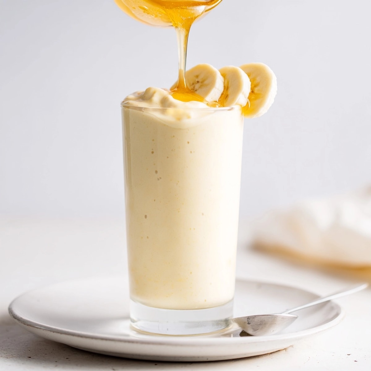 Making a delicious Healthy Banana Smoothie: bananas, yogurt, and milk blended for a simple breakfast.