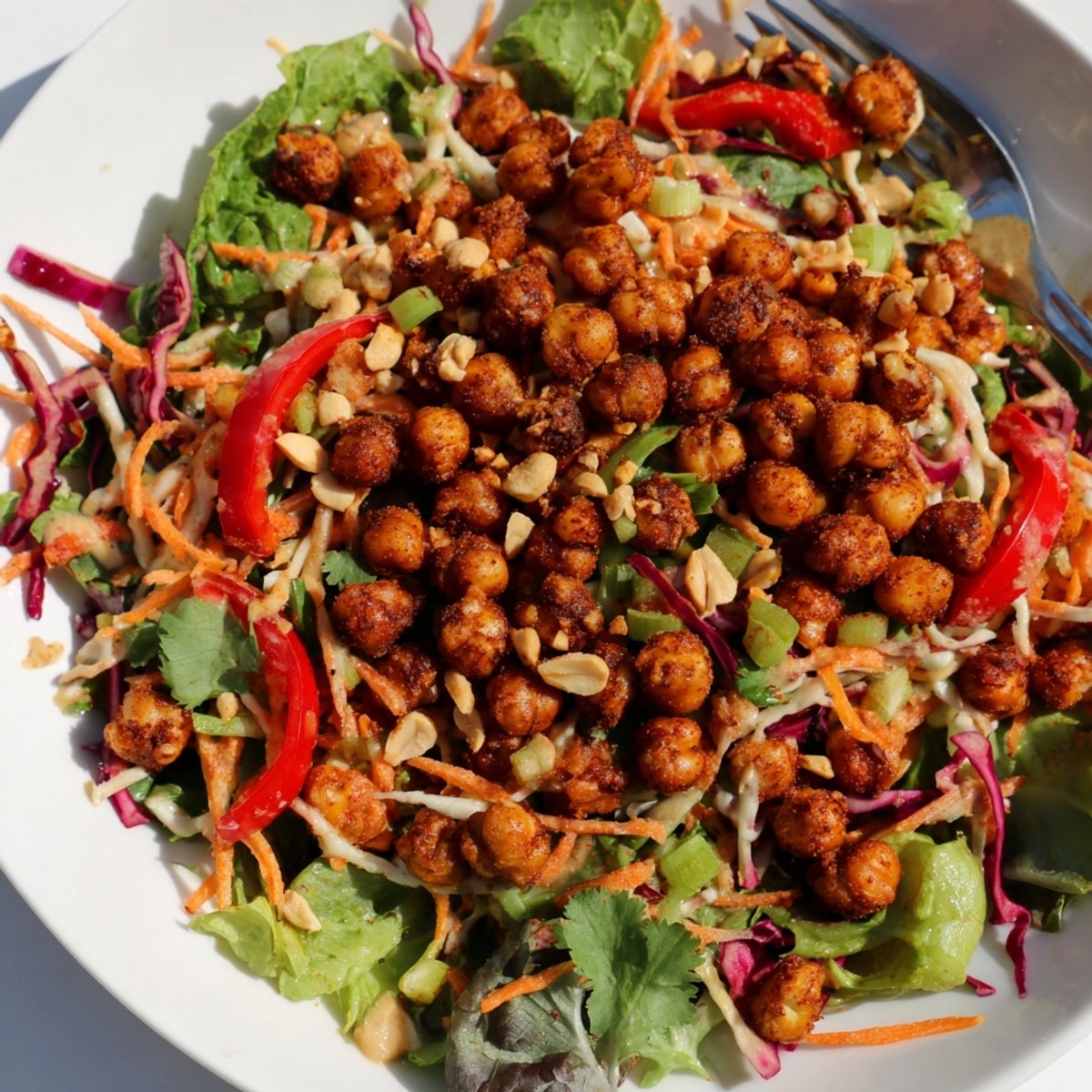 Close-up of the vibrant Thai Peanut Roasted Chickpea Salad, ready to serve.