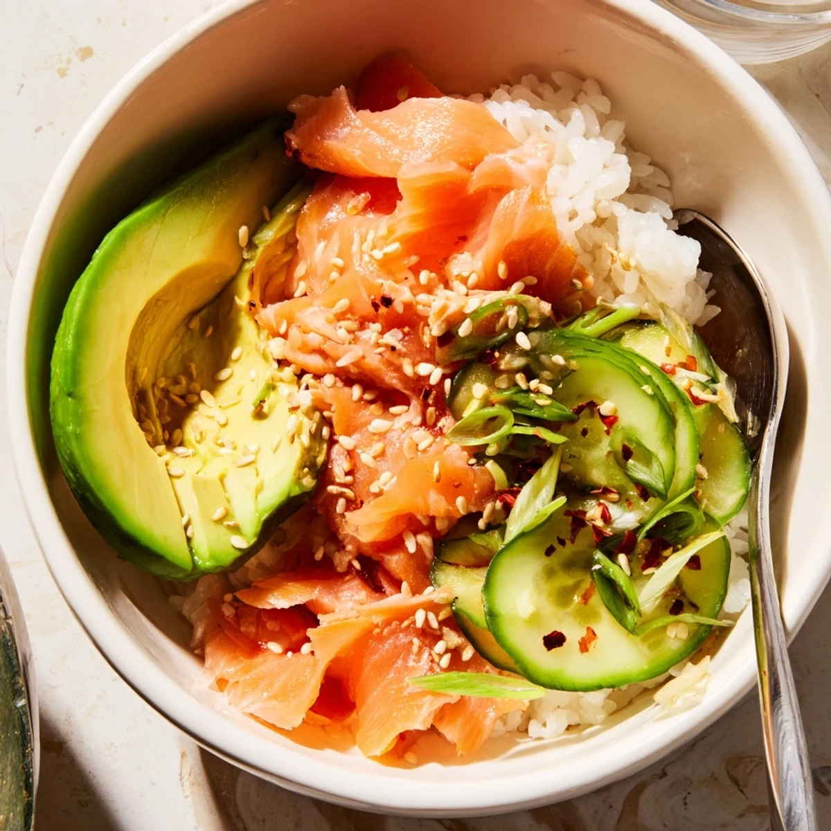 Savory leftover salmon and rice bowl bursting with vibrant flavors and colors.