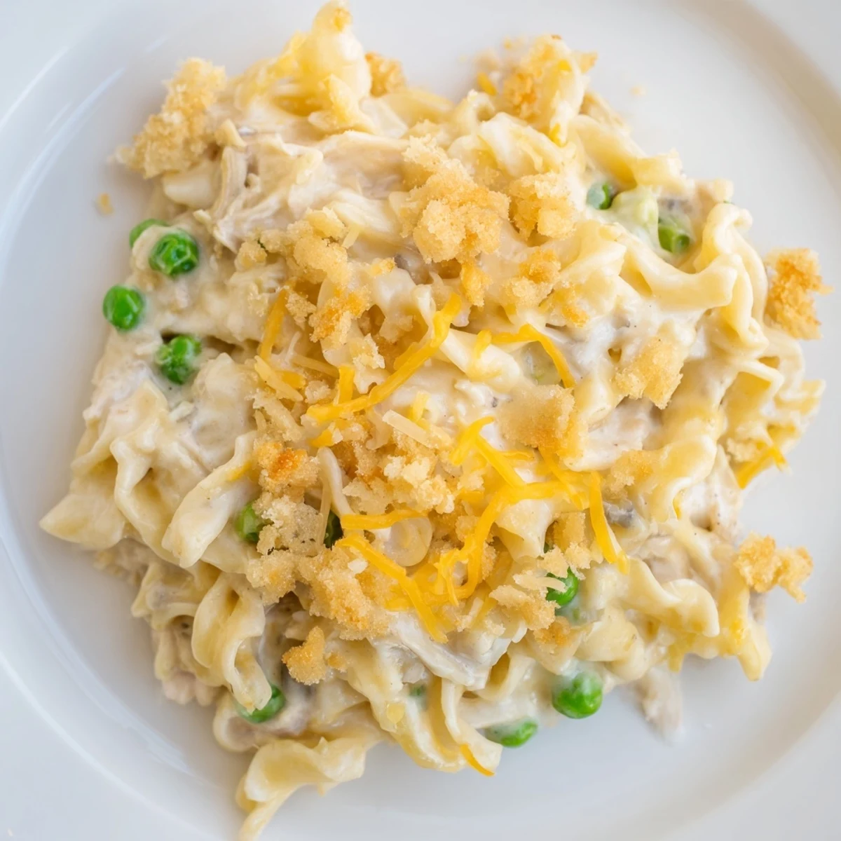 A family-sized baking dish of comforting Creamy Tuna Noodle Casserole, topped with crispy crackers.