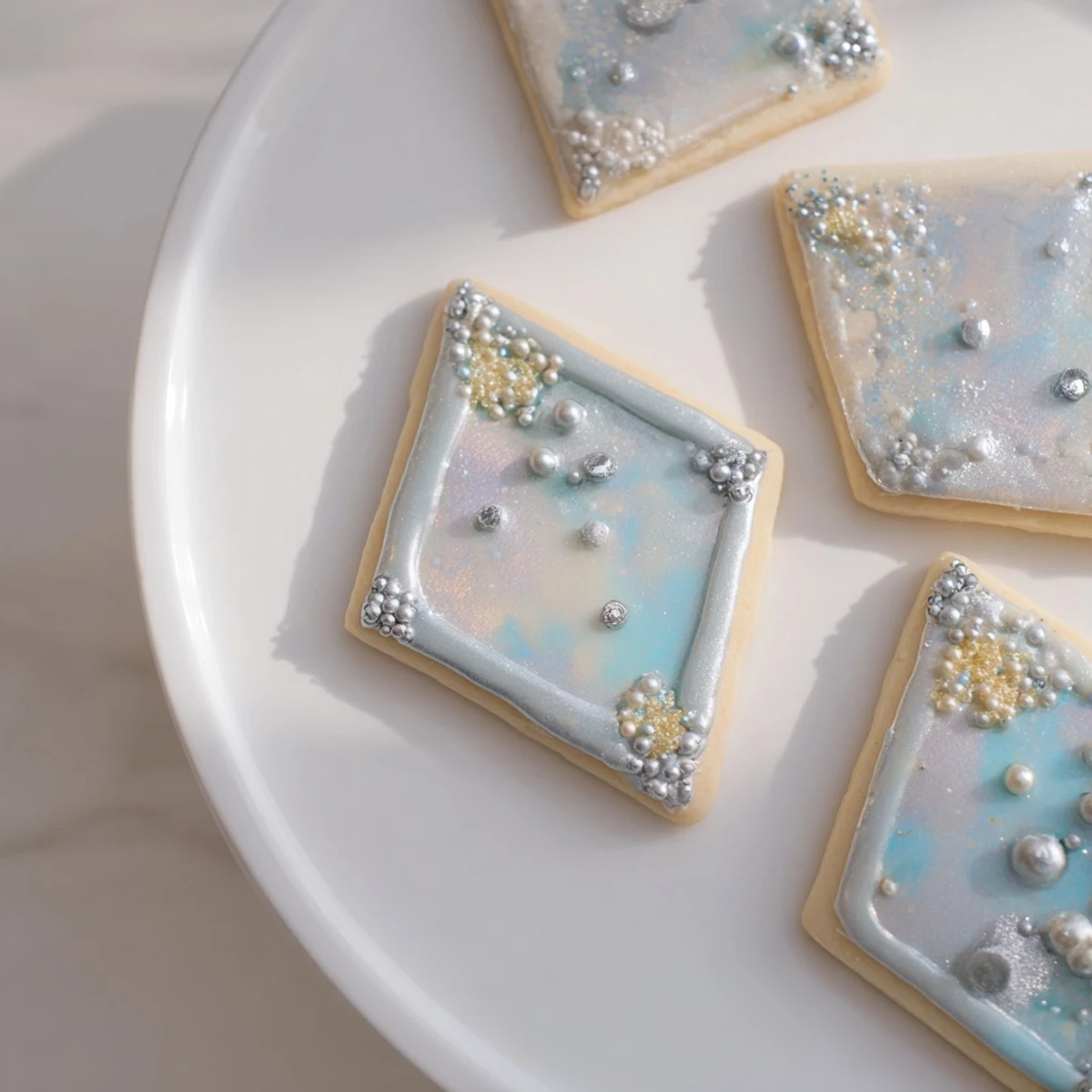 Close-up of the Engagement Ring Diamond Dessert Tray: diamond cookies with edible pearls, a sweet, elegant presentation.