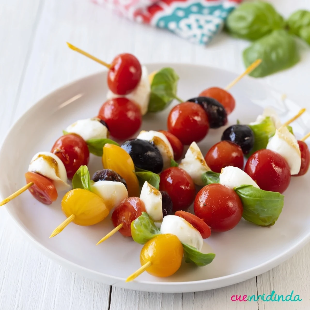 Freshly made Christmas Lights Olive and Tomato Skewers, a fun vegetarian appetizer for sharing with friends and family.