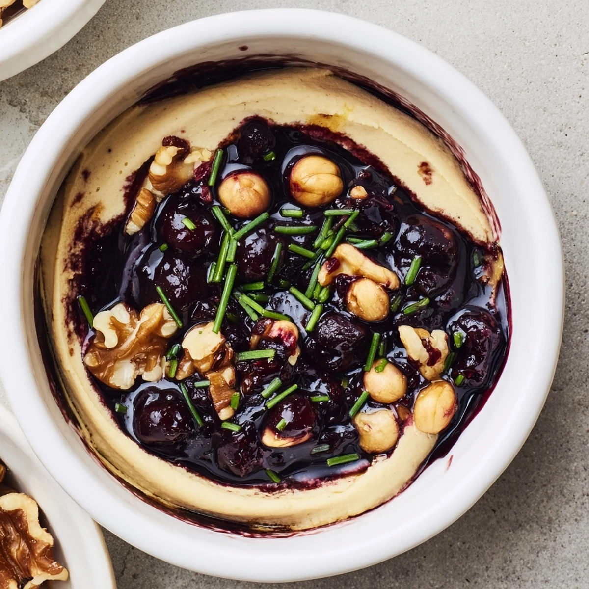 A layered presentation of The Velvet Underground, showing creamy pâté, sweet jam and crunchy nuts.