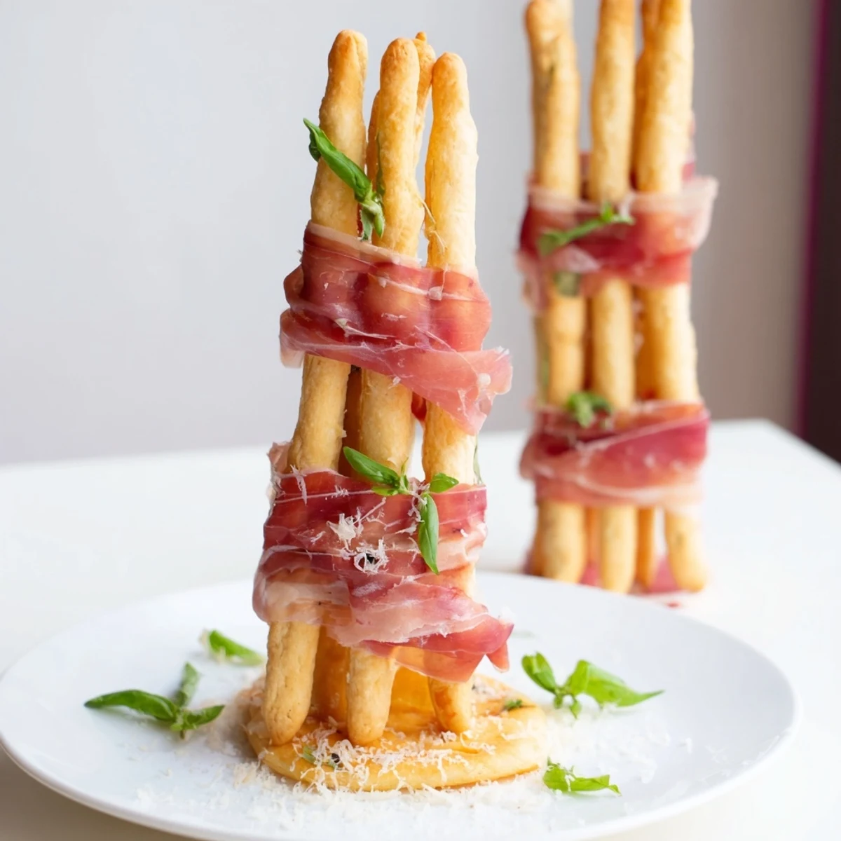 Crisp breadsticks support flavorful prosciutto “bridges” in this simple and elegant Golden Gate appetizer, perfect for sharing.