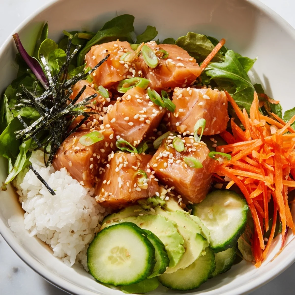 Freshly marinated poke bowl salad with vibrant colors and tender, cubed salmon.