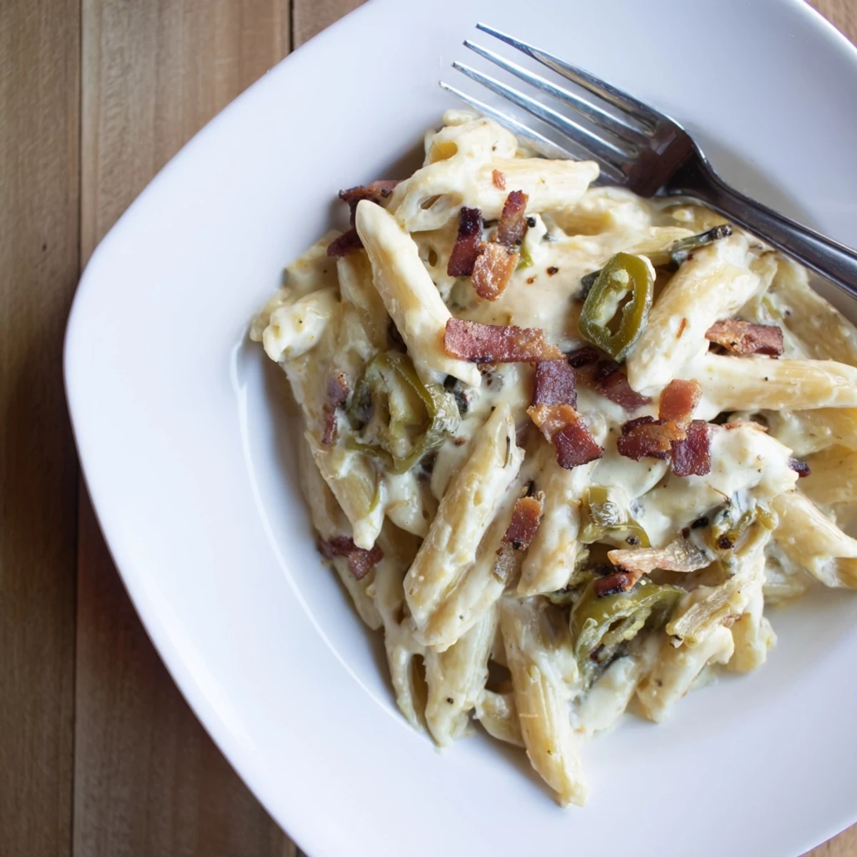 Freshly chopped chives and a forkful of gooey cheese sauce showcase the rich texture and smoky paprika notes in this decadent Jalapeño Popper Pasta.