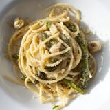 Roasted Garlic & Asparagus Pasta is garnished with fresh parsley and lemon zest for bright flavor.  