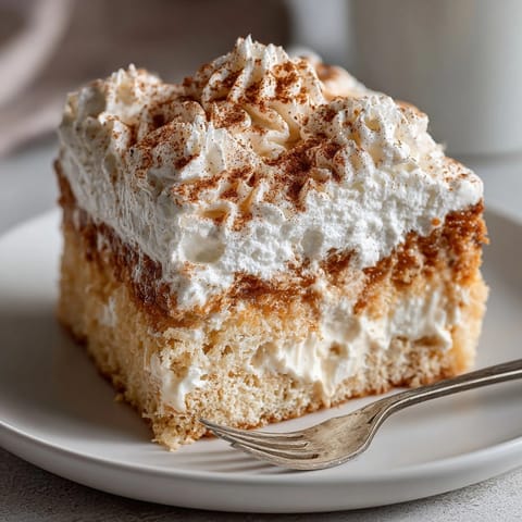 Delectable Pumpkin Spice Tres Leches Cake: Layers of moist cake, soaked milky goodness.