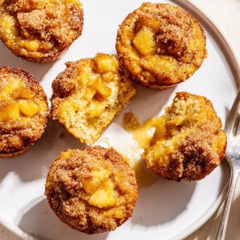 Warm, gooey caramel apple bourbon muffin bites perfect for autumn gatherings and indulgence.  