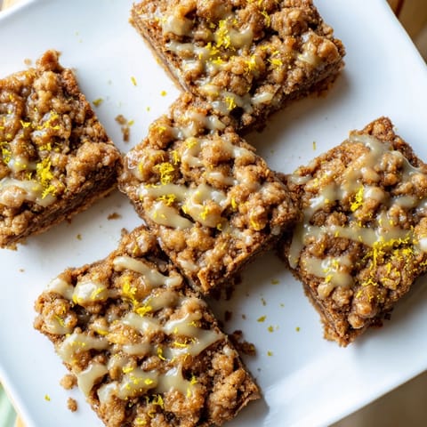 Imagine the warm spices of these Gingerbread Crumble Bars, perfectly balanced by a bright lemon glaze.