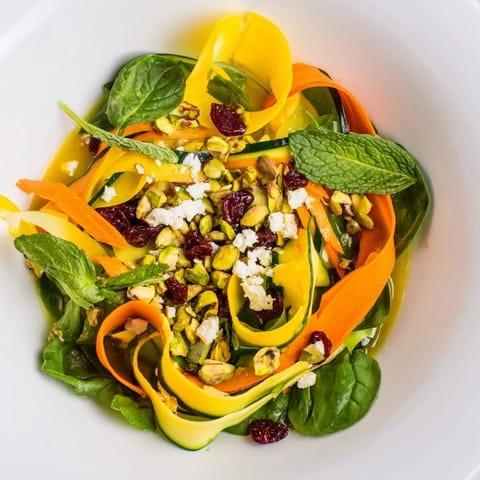 Fresh, layered Pistachio and Cranberry Ribbon Salad with bright ribbons, crunchy pistachios, and tangy cranberries.