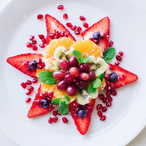 Bright, colorful Festive Poinsettia Fruit Bowl with juicy strawberries, perfect for a holiday breakfast.