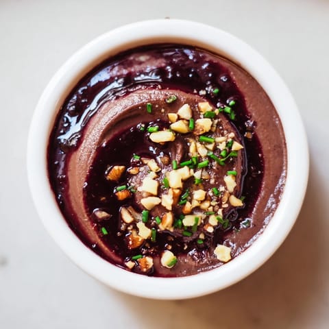 Delightful close-up of The Velvet Underground appetizer with smooth pâté, vibrant jams, and toasted nuts.