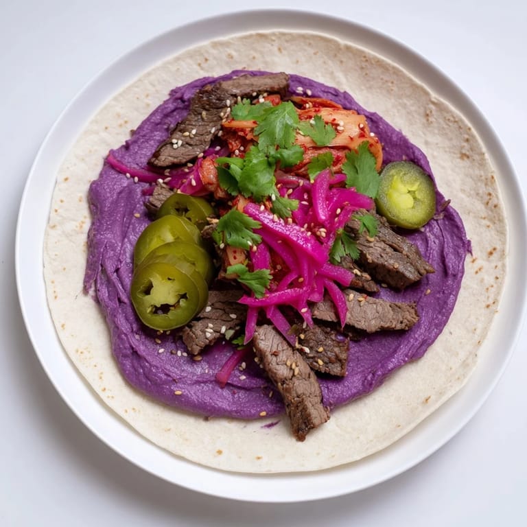 Savory Korean-inspired tacos with zesty jalapeños and creamy ube dressing.