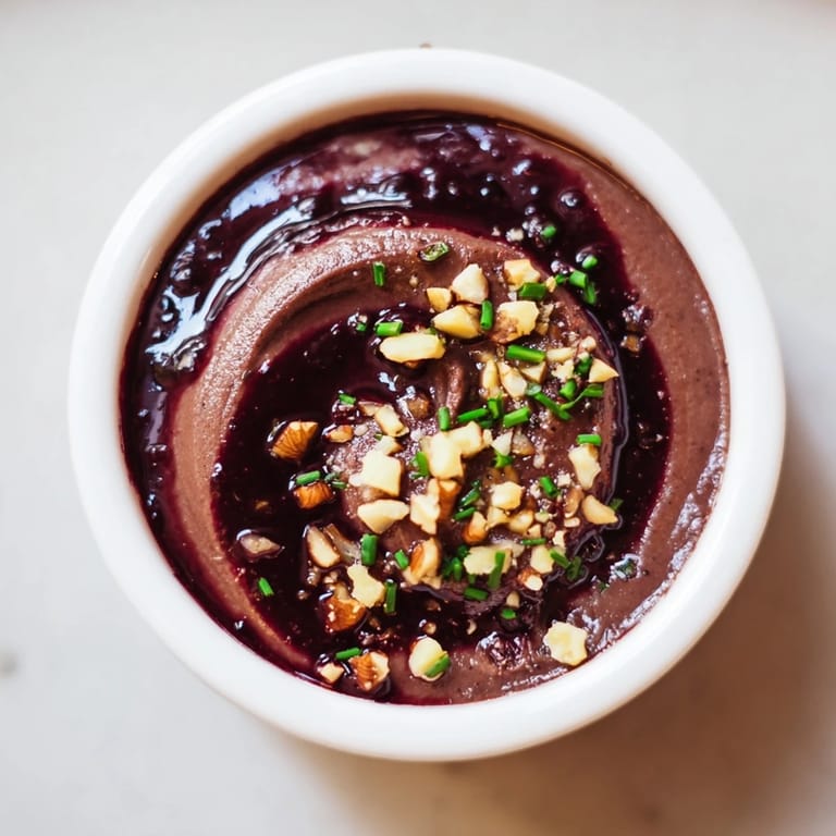 Delightful close-up of The Velvet Underground appetizer with smooth pâté, vibrant jams, and toasted nuts.