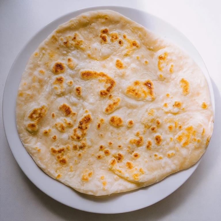 Deliciously simple Cottage Cheese Flatbread: golden, flaky rounds, perfect for scooping up your favorite dips.